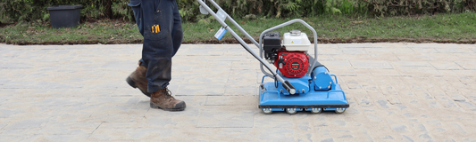 Compacting polymeric sand on an interlock driveway